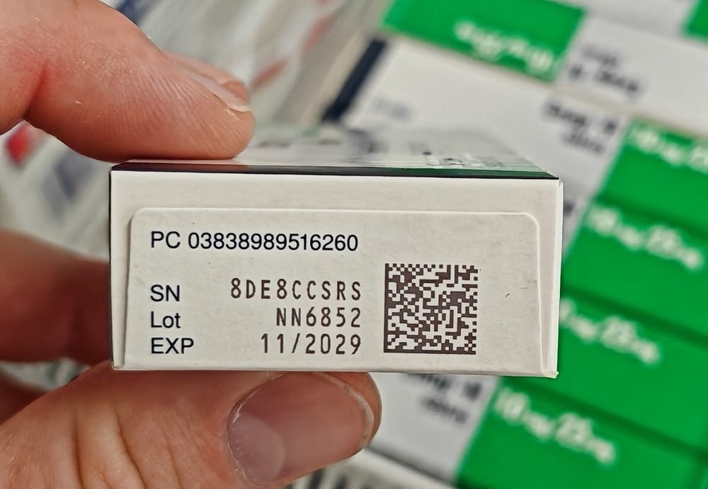 Serialised pharmaceutical carton printed with a 2D data matrix code alongside human-readable product code, serial number, batch number and expiry date