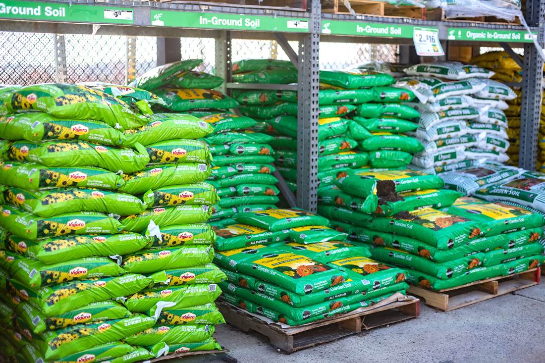 Filled printed woven sacks stacked on pallets